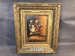 Ancien tableau huile sur bois bouquet de fleurs dans cadre en bois et plâtre