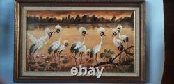 Tableau ancien à l'huile signé représentant un paysage avec des grues sauvages