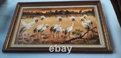 Tableau ancien à l'huile signé représentant un paysage avec des grues sauvages