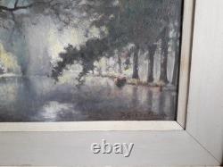 Tableau ancien à l'huile sur un panneau de bois représentant un paysage