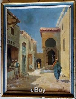 Tableau ancien signé école orientaliste scène de rue ou souk en Tunisie